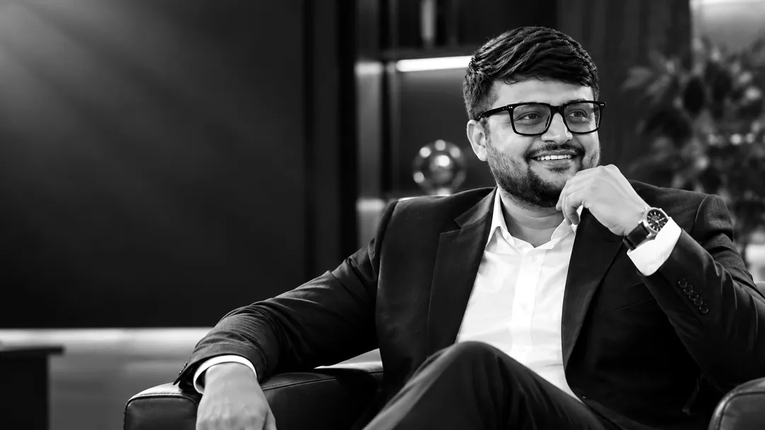 Black-and-white portrait of Umesh Khivasara, seated, in thought